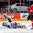 PRAGUE, CZECH REPUBLIC - MAY 6: Latvia's Edgars Maslaskis #31 sprawls out to make the save against Switzerland's Damien Brunner #96 during preliminary round action at the 2015 IIHF Ice Hockey World Championship. (Photo by Andre Ringuette/HHOF-IIHF Images)


